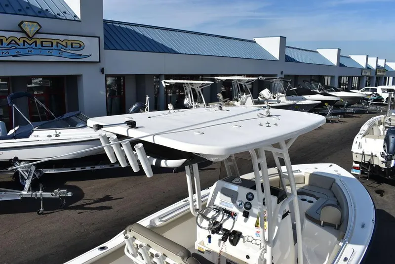 Slide: The Image of 2022 Key West 219fs boat displayed at a marine dealership. - 14