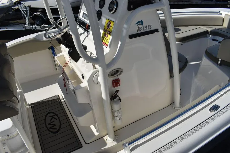 Slide: The Image of 2022 Key West 219fs boat interior with steering console and safety equipment. - 17