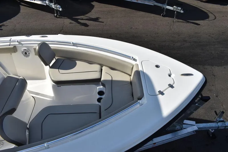 Slide: The Image of 2022 Key West 219fs boat with cushioned seating and cup holders. - 21