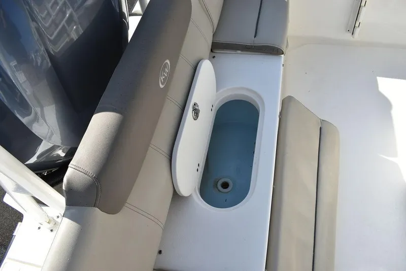 Slide: The Image of 2022 Key West 219fs boat seating with built-in storage compartment. - 28