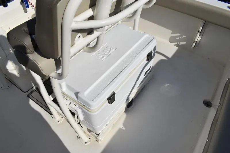Slide: The Image of 2022 Key West 219fs boat interior with cooler under seat. - 40