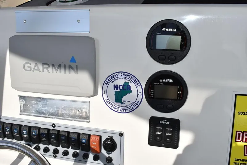 Slide: The Image of Garmin navigation system on 2022 Key West 219fs boat dashboard with Yamaha controls. - 41