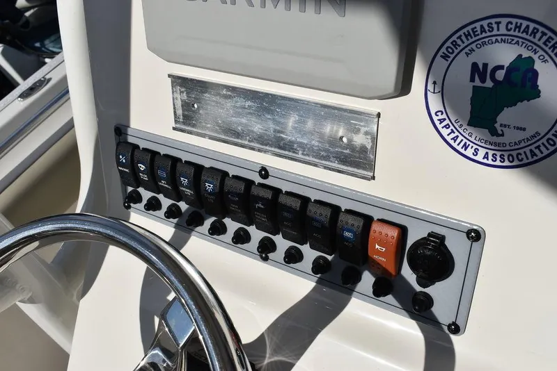 Slide: The Image of Key West 219fs 2022 boat dashboard with control panel and steering wheel. - 42