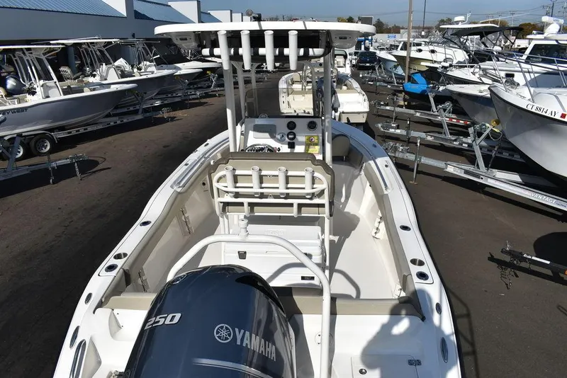 Slide: The Image of 2022 Key West 219fs boat with Yamaha 250 engine, displayed in a marina. - 8