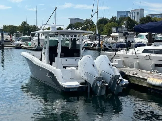 Slide: The Image of 2025 Crevalle 33 CTF boat docked in marina with twin engines. - 15