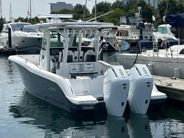 Slide: The Image of 2025 Crevalle 33 CTF boat docked with twin outboard engines. - 7