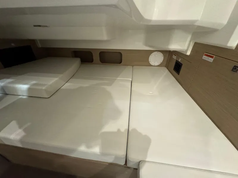 Slide: The Image of 2025 Jeanneau Leader 9.0 WA Series 2 cabin interior with cushioned seating. - 14