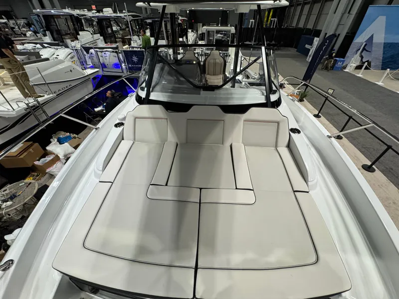 Slide: The Image of 2025 Jeanneau Leader 9.0 WA Series 2 boat with spacious deck and seating area. - 18