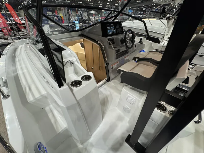 Slide: The Image of 2025 Jeanneau Leader 9.0 WA Series 2 boat interior with modern helm and seating. - 5