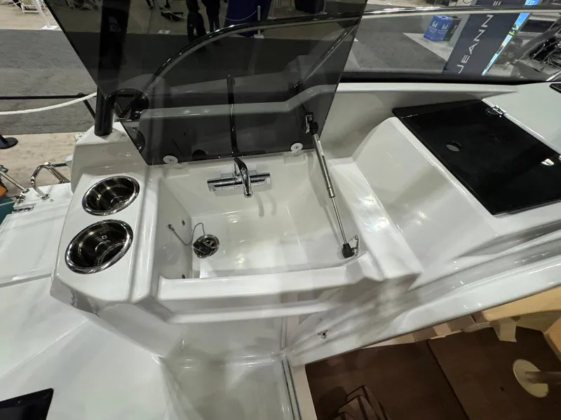 Slide: The Image of 2025 Jeanneau Leader 9.0 WA Series 2 boat interior with sink and cup holders. - 6