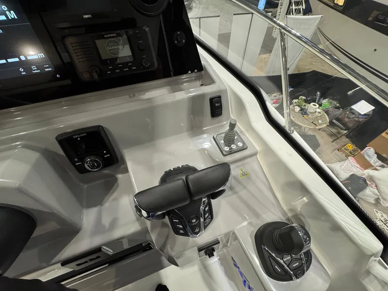 Slide: The Image of 2025 Jeanneau Leader 9.0 WA Series 2 cockpit with modern controls and navigation system. - 9