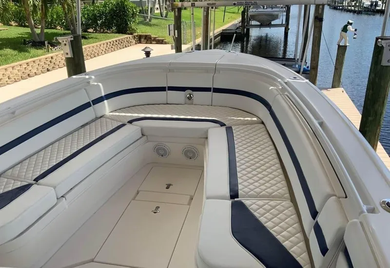 Slide: The Image of 2015 Intrepid 327 Center Console boat with spacious seating and elegant design. - 3