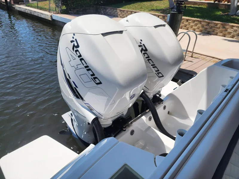 Slide: The Image of Twin Mercury Racing 400 outboard engines on a 2015 Intrepid 327 Center Console boat. - 41