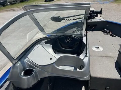 Slide: The Image of 2013 Tracker 175 Pro Guide boat interior with steering wheel and windshield. - 4