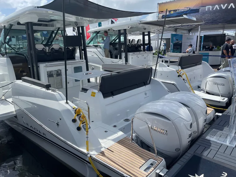 The Image of 2025 Jeanneau Leader 10.5 WA Series 2 boat with twin Yamaha engines at a marina. - 0