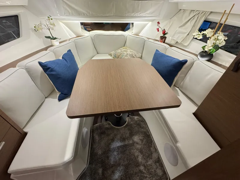 Slide: The Image of Luxurious interior of 2025 Jeanneau Leader 10.5 WA Series 2 with elegant seating and table. - 20