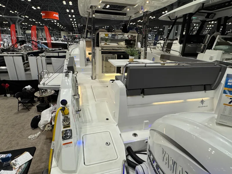 Slide: The Image of 2025 Jeanneau Leader 10.5 WA Series 2 boat interior at a boat show. - 5
