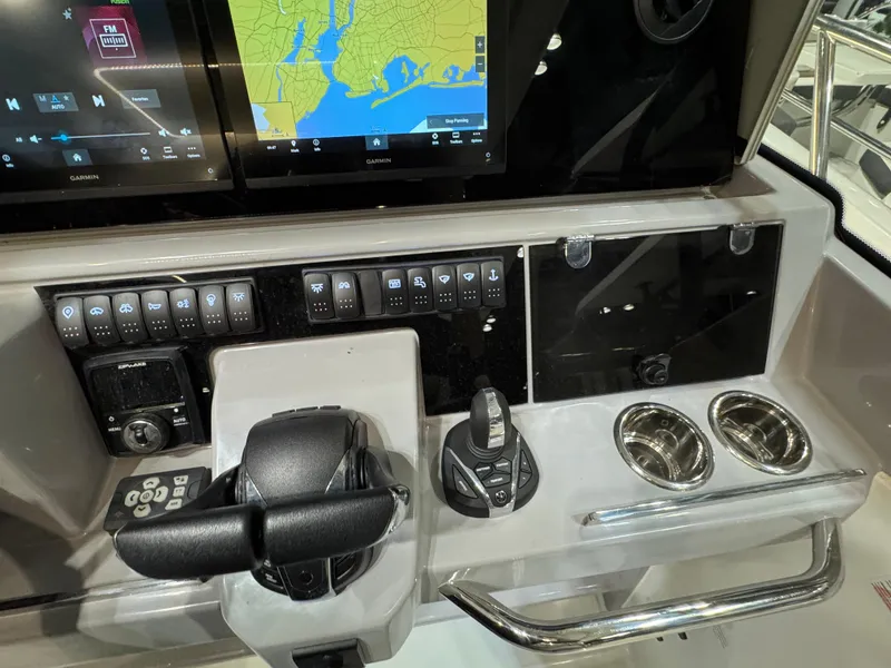 Slide: The Image of 2025 Jeanneau Leader 10.5 WA Series 2 dashboard with navigation and control systems. - 13
