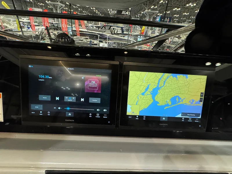 Slide: The Image of Dashboard of 2025 Jeanneau Leader 10.5 WA Series 2 with navigation and audio displays. - 14
