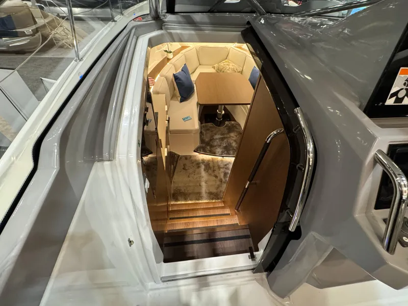 Slide: The Image of 2025 Jeanneau Leader 10.5 WA Series 2 interior, featuring cozy seating and modern design. - 17