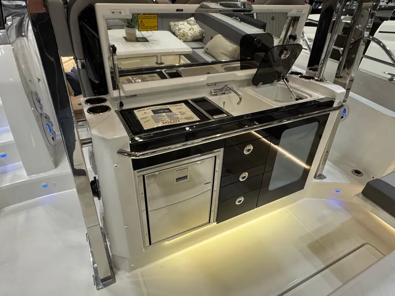 Slide: The Image of 2025 Jeanneau Leader 10.5 WA Series 2 boat kitchen area with modern amenities. - 8