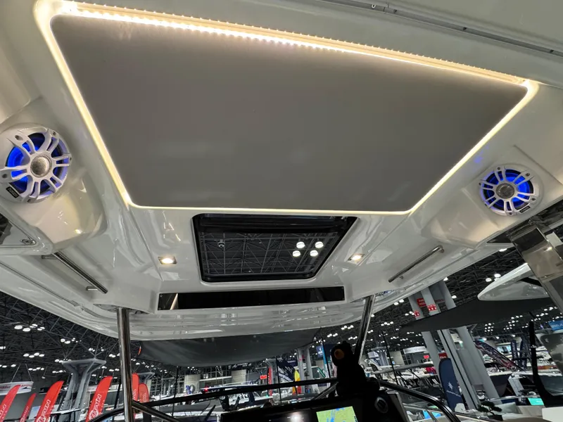 Slide: The Image of Interior view of 2025 Jeanneau Leader 10.5 WA Series 2 boat with modern lighting and speakers. - 9