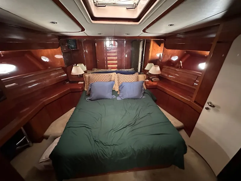 Slide: The Image of Luxurious cabin interior of 2001 Johnson 70 yacht with cozy bedding. - 15