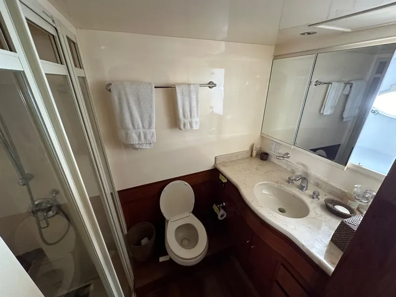 Slide: The Image of Luxurious bathroom in 2001 Johnson 70 yacht with shower, toilet, and vanity. - 20