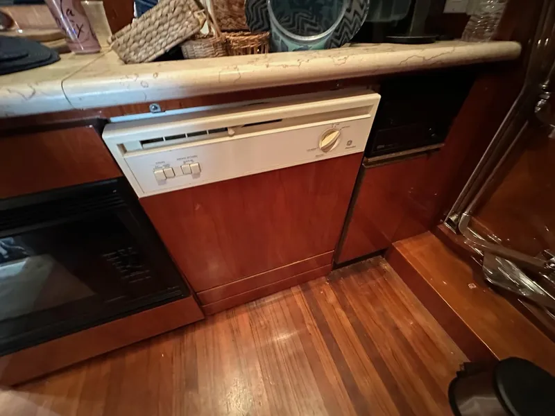 Slide: The Image of Wooden kitchen interior with a built-in Johnson 70 appliance, 2001 model. - 22