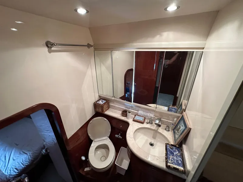 Slide: The Image of Luxurious bathroom in 2001 Johnson 70 yacht with modern fixtures and elegant design. - 23