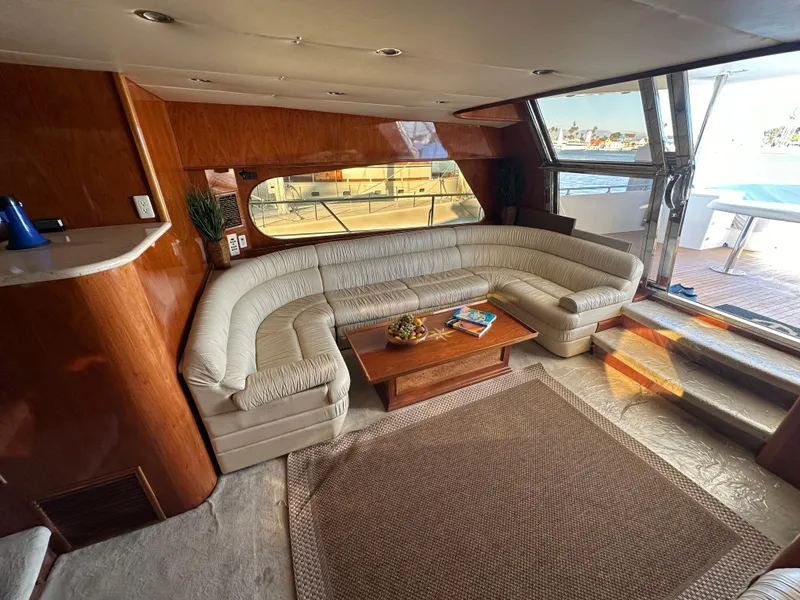 Slide: The Image of Luxurious interior of 2001 Johnson 70 yacht with plush seating and wooden accents. - 37