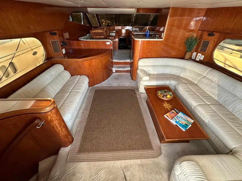 Slide: The Image of Luxurious 2001 Johnson 70 yacht interior with plush seating and elegant wood finishes. - 42