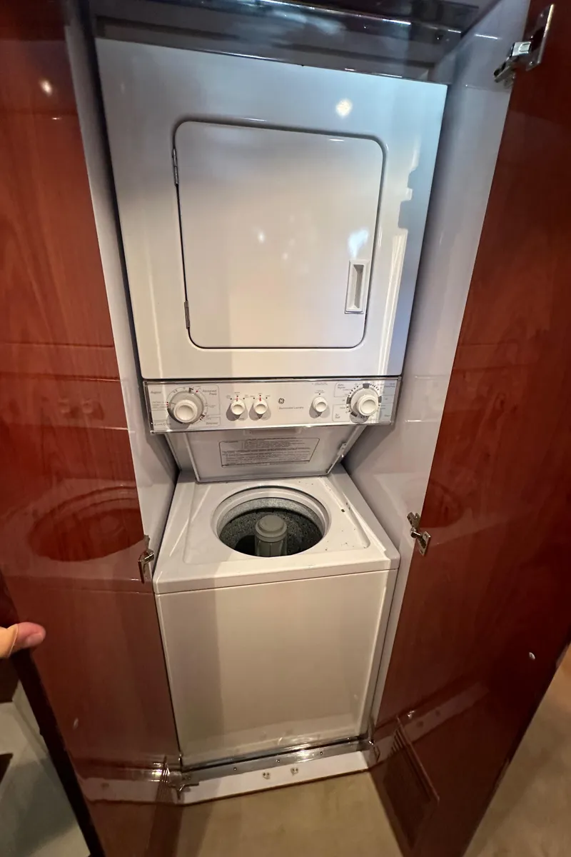 Slide: The Image of Stacked washer and dryer in wooden cabinet, Johnson 70 model, 2001. - 45