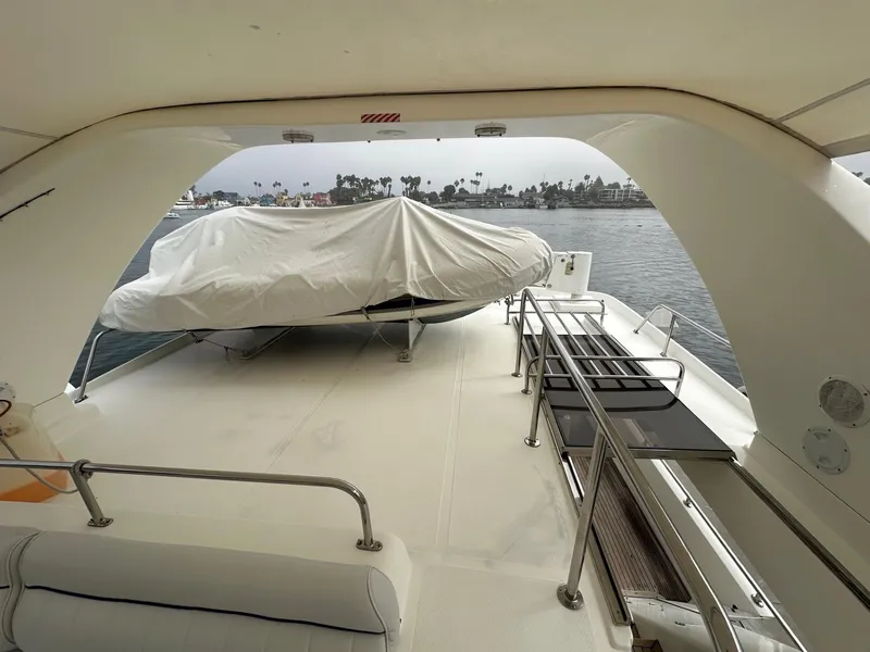 Slide: The Image of Covered deck of 2001 Johnson 70 yacht with ocean view. - 8