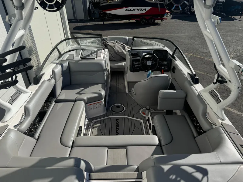 Slide: The Image of 2022 Moomba Mondo boat interior with sleek seating and modern dashboard. - 6