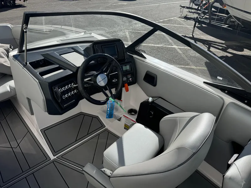 Slide: The Image of 2022 Moomba Mondo boat interior with steering wheel and dashboard controls. - 8