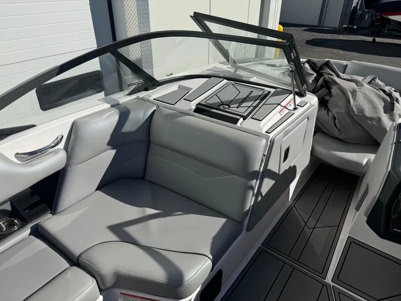 Slide: The Image of 2022 Moomba Mondo boat interior with gray seating and sleek design. - 9