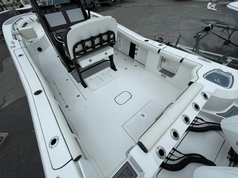Slide: The Image of 2021 Tidewater 272 CC Adventure boat interior with seating and storage compartments. - 11