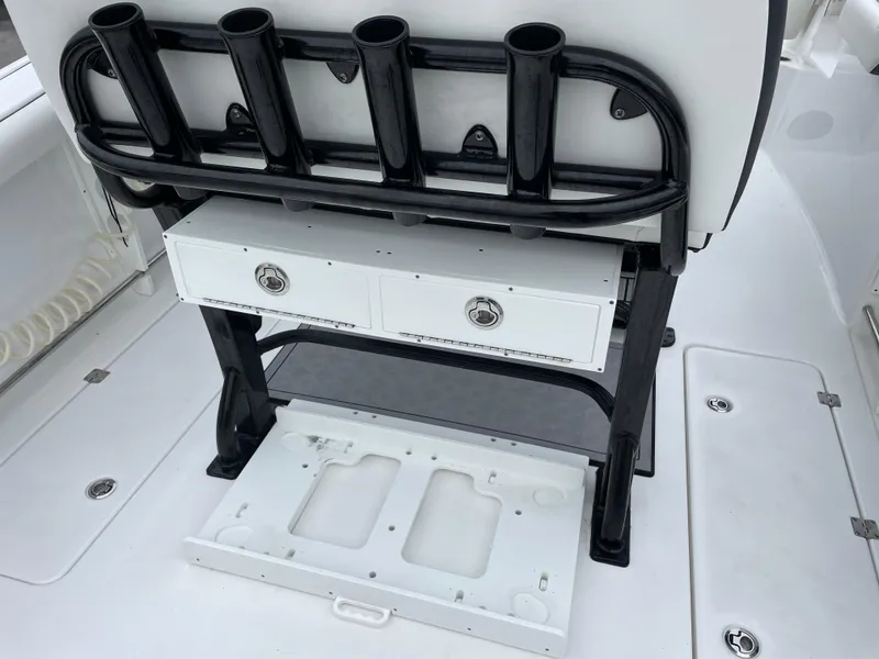 Slide: The Image of Tidewater 272 CC Adventure 2021 boat storage and rod holders. - 13