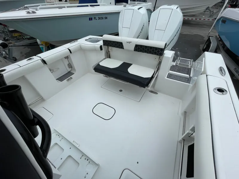 Slide: The Image of 2021 Tidewater 272 CC Adventure boat with spacious deck and dual engines. - 16