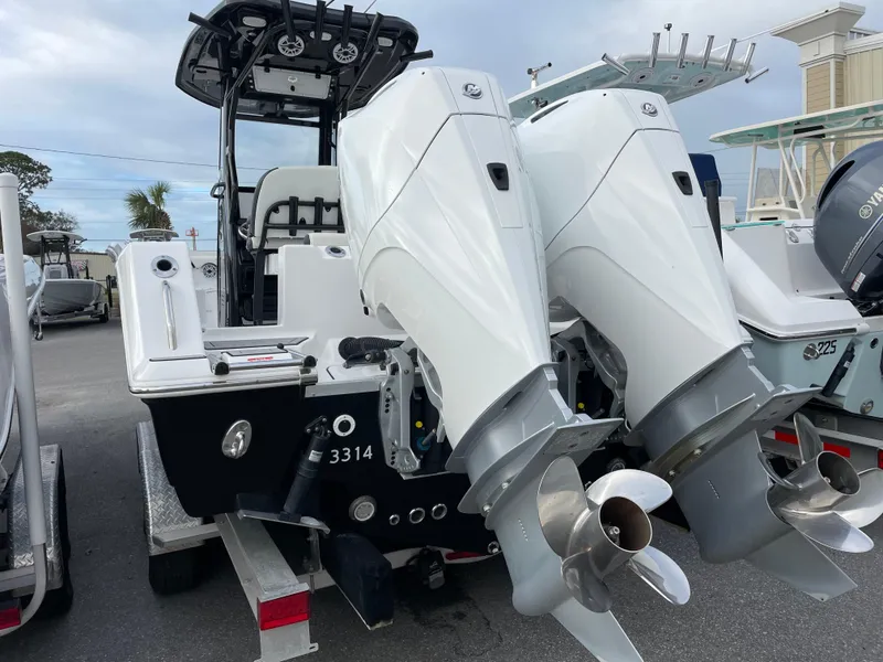 Slide: The Image of 2021 Tidewater 272 CC Adventure boat with dual outboard engines. - 18