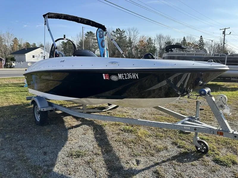 Slide: The Image of 2019 Bayliner E16 boat on trailer, parked outdoors. - 2