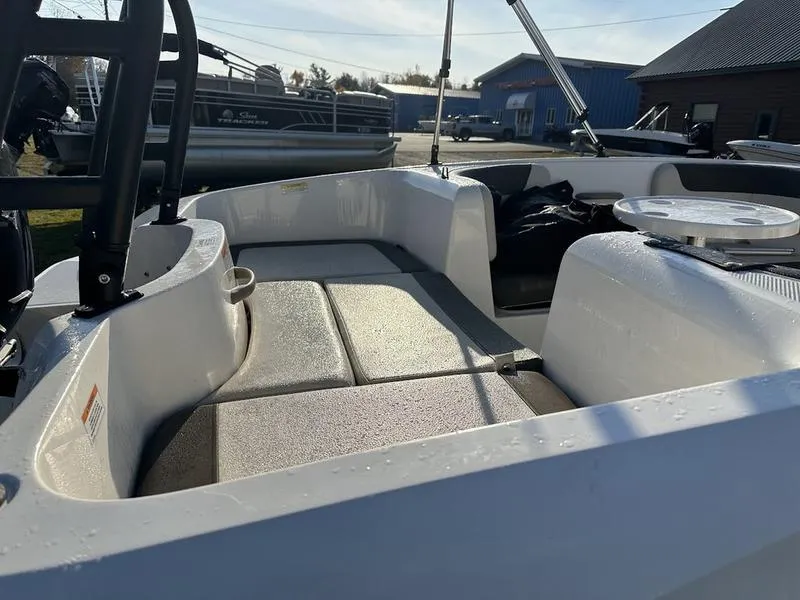 Slide: The Image of 2019 Bayliner E16 boat interior with seating and open deck. - 4