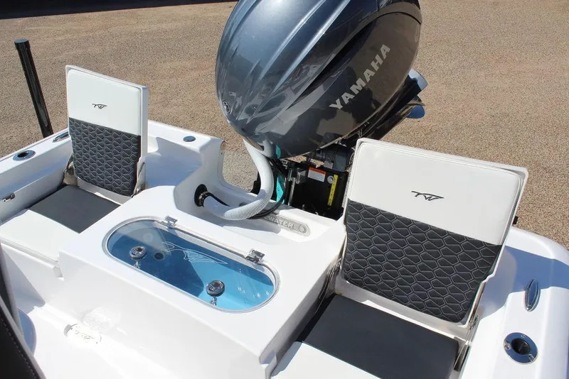 Slide: The Image of 2025 Tidewater 2110 Bay Max boat with Yamaha engine and seating. - 12