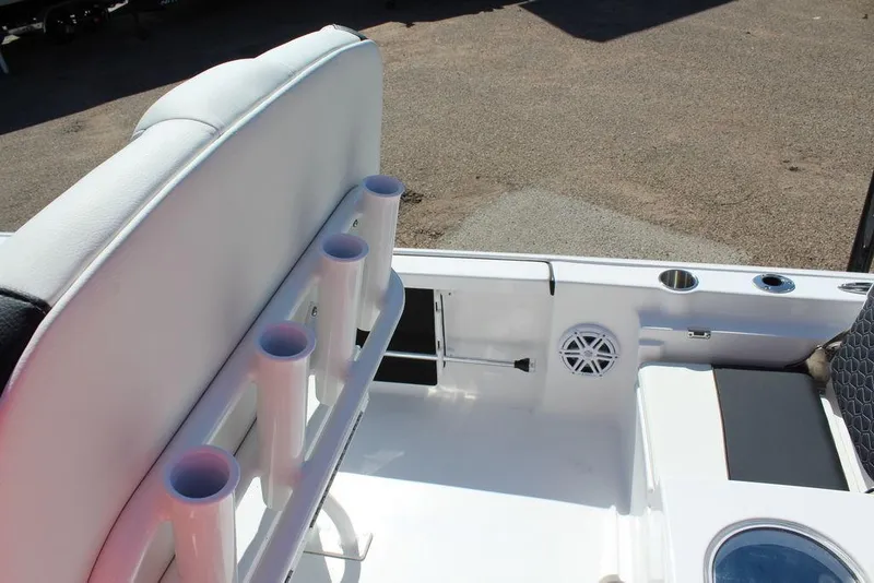 Slide: The Image of 2025 Tidewater 2110 Bay Max boat interior with rod holders and seating. - 15