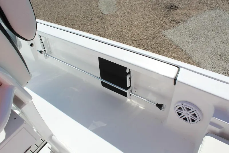 Slide: The Image of 2025 Tidewater 2110 Bay Max boat interior with rod holder and speaker. - 16