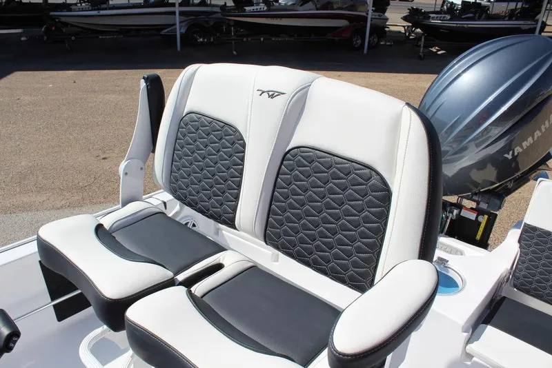 Slide: The Image of 2025 Tidewater 2110 Bay Max boat seats with Yamaha engine in background. - 17