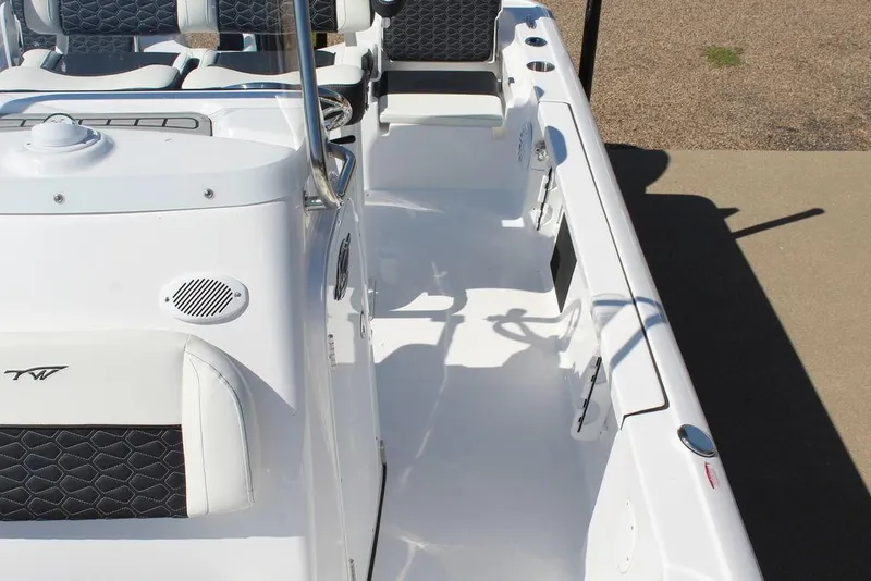 Slide: The Image of 2025 Tidewater 2110 Bay Max boat interior with white seating and modern design. - 23
