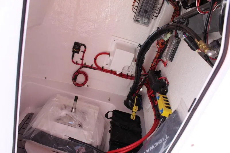 Slide: The Image of 2025 Tidewater 2110 Bay Max boat wiring and battery compartment. - 27