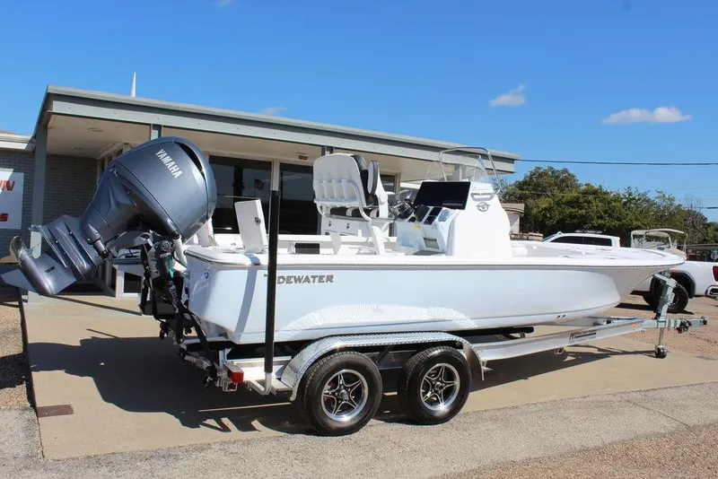 Slide: The Image of 2025 Tidewater 2110 Bay Max boat on trailer, parked outdoors. - 3